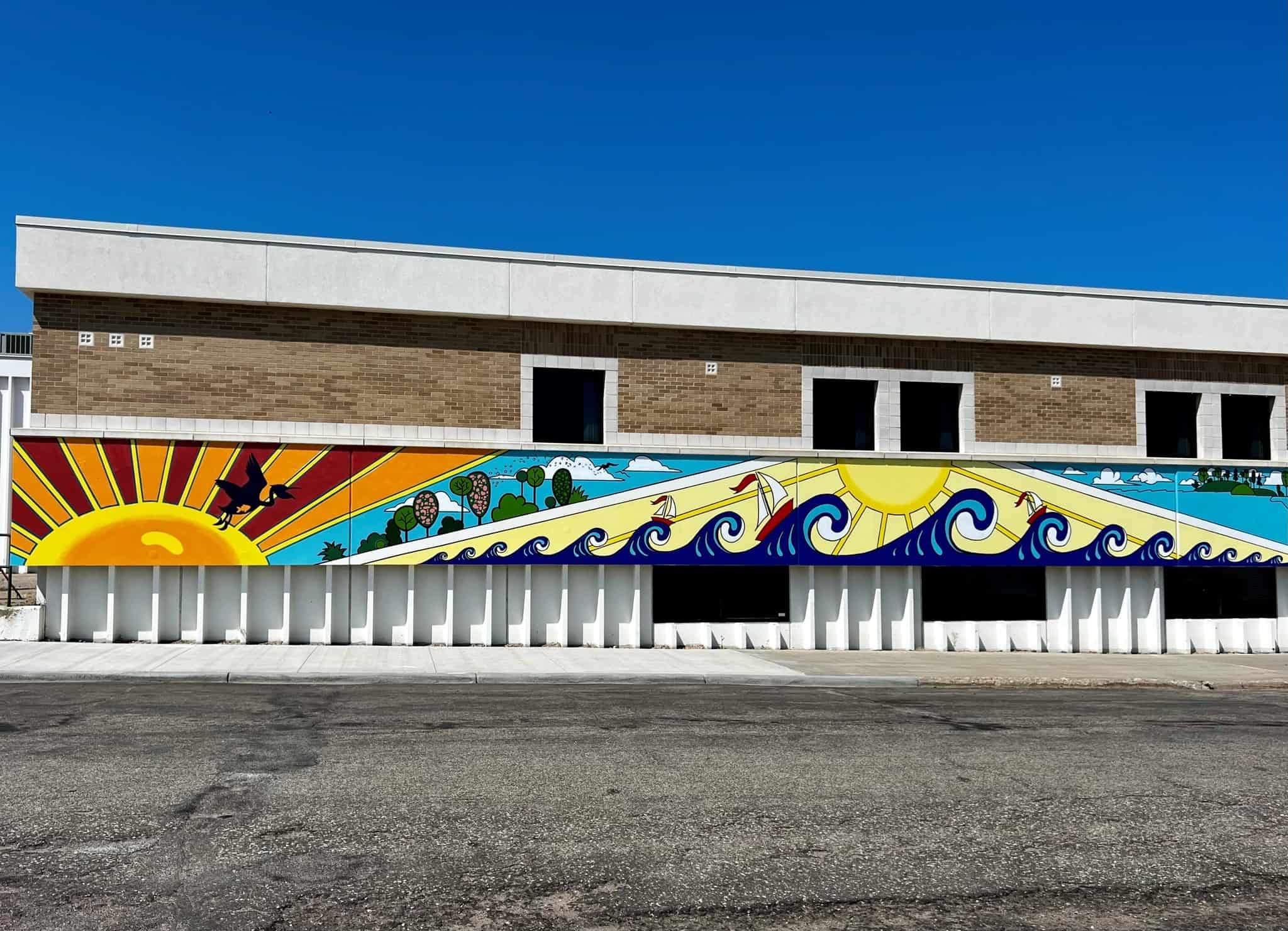 "Embracing Equinox" mural • on the wall of the Becker County Human Services Center building • Artists: Deneena & Sophie Hughes